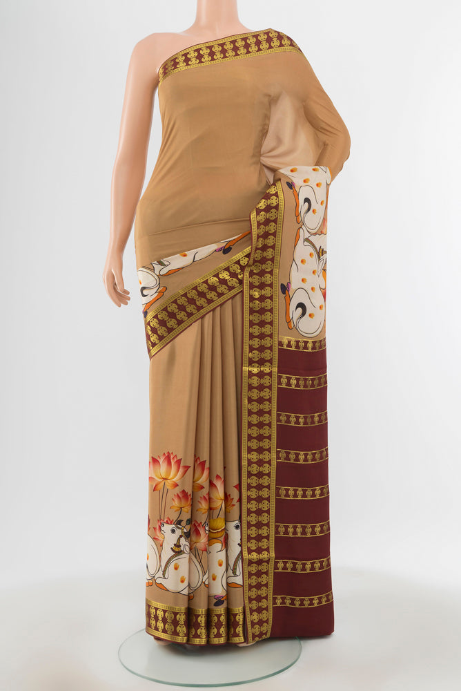 Dark Beige Mysore Crepe Saree with Floral Print on the body and Silk Border.  displayed on a mannequin
