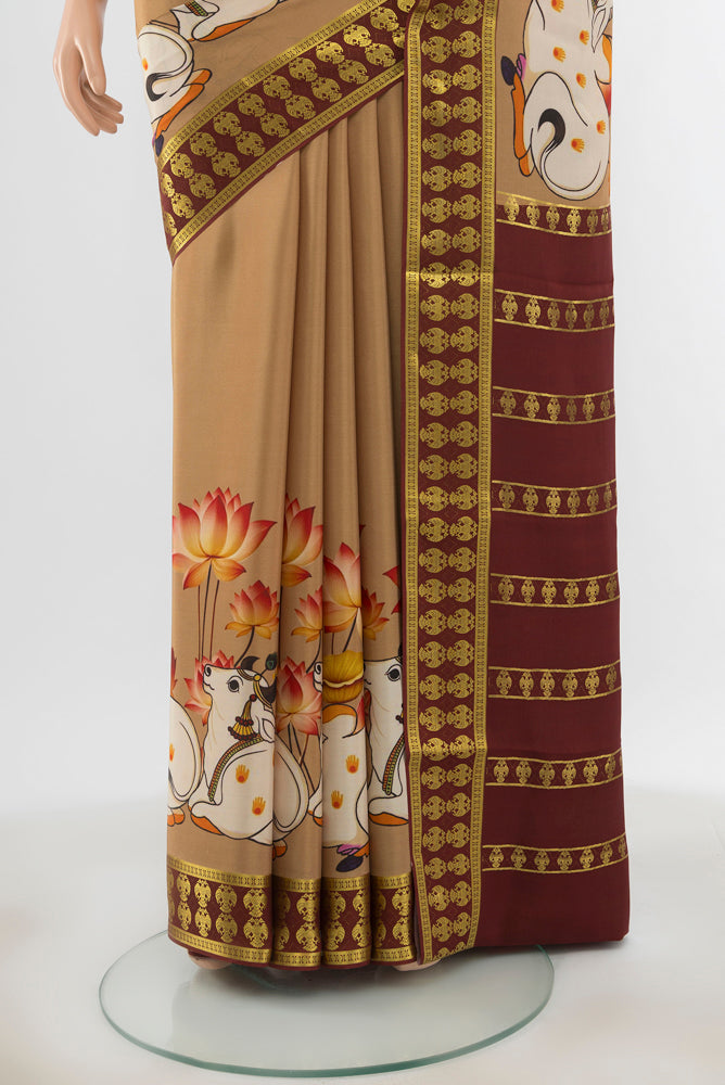 Pleats and pallu of Dark Beige Mysore Crepe Saree with Floral Print on the body and Silk Border. 
