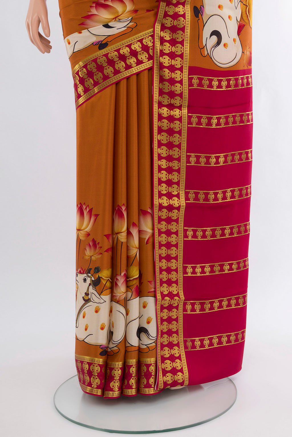 Pleats and pallu of Mustard Mysore Crepe Saree with Plain Body and Zari Border. 