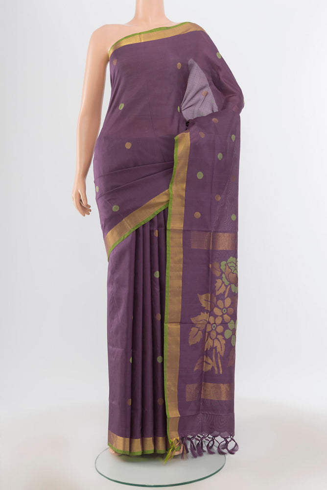 Pure Silk Pure Zari Violet Uppada Saree with Zari Butta on the body and Silk Border.  displayed on a mannequin