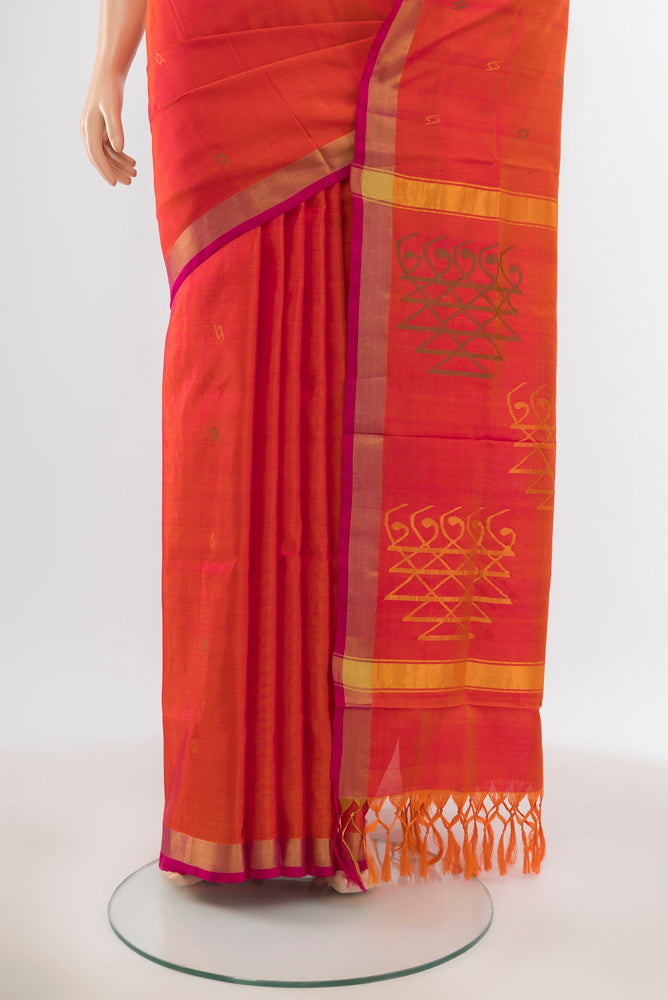 Pleats and pallu of Pure Silk Pure Zari Peach Uppada Saree with Zari Butta on the body and Silk Border. 