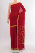 Pure Silk Pure Zari Maroon Uppada Saree with Zari Butta on the body and Silk Border.  displayed on a mannequin