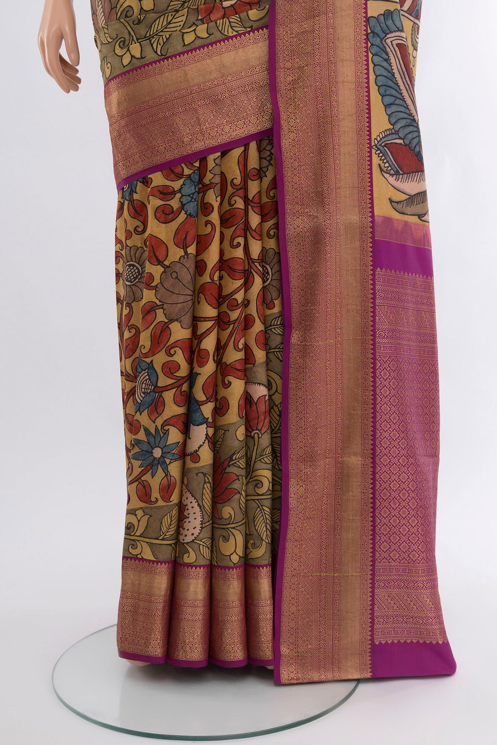 Pleats and pallu of Brown Kanjivaram Silk Saree with Floral Print on the body and Zari Border. 