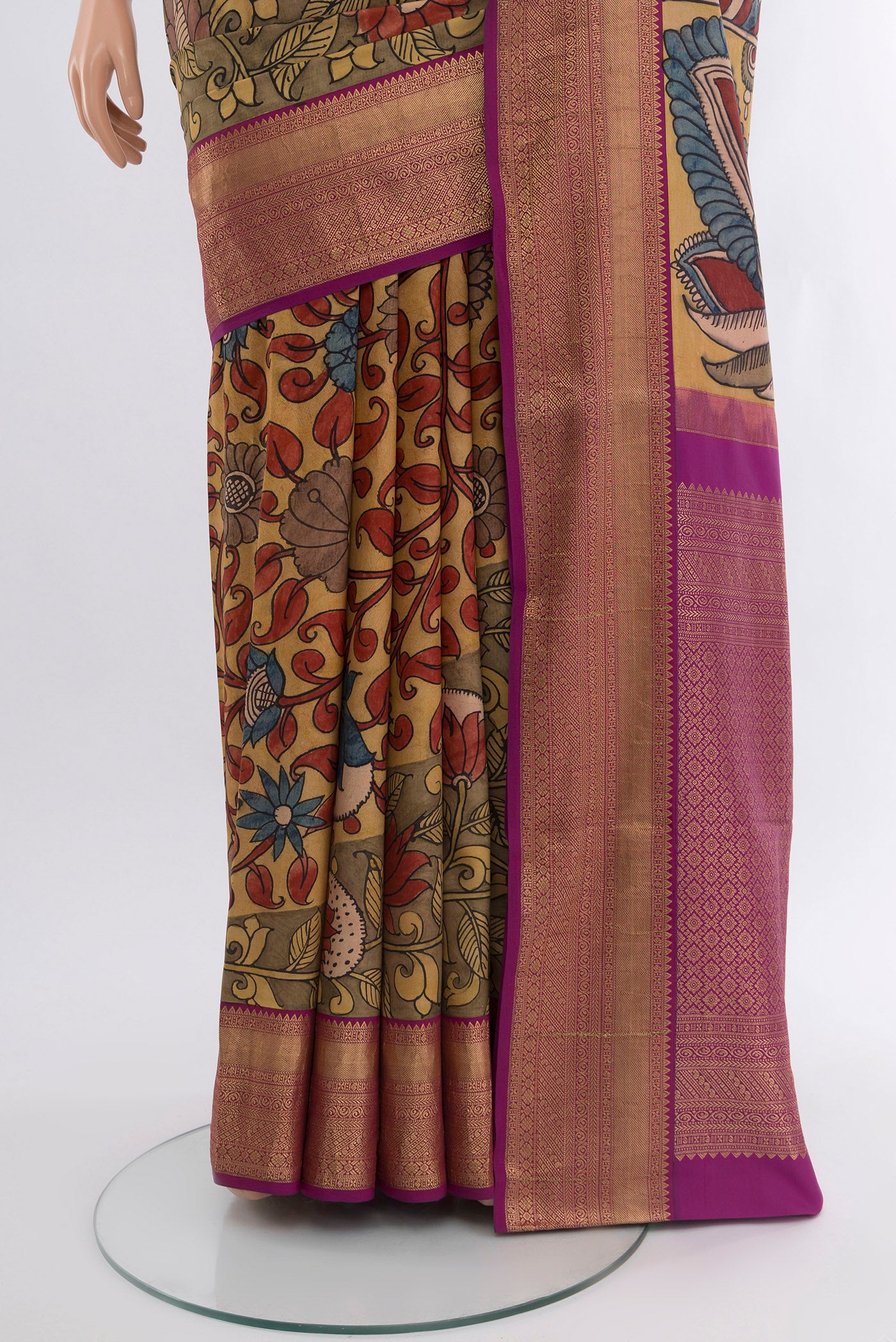 Pleats and pallu of Brown Kanjivaram Silk Saree with Floral Print on the body and Zari Border. 