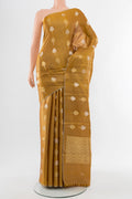 Golden Tussar Silk Saree with Zari Butta on the body and Silk Border.  displayed on a mannequin