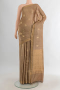 Beige Tussar Saree with Zari Butta on the body and Zari Border.  displayed on a mannequin