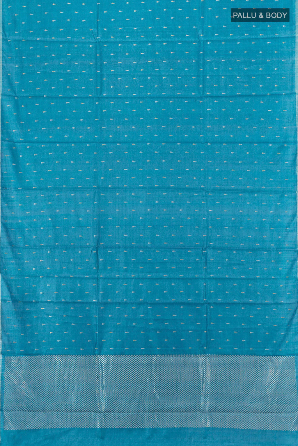 Flat view of Sky Blue Tussar Silk Saree with Zari Butta on the body and Plain Border. 