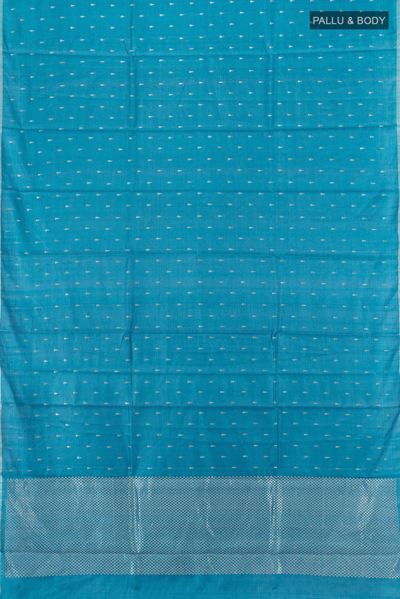 Flat view of Sky Blue Tussar Silk Saree with Zari Butta on the body and Plain Border. 