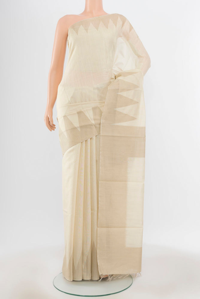 Pure Silk Pure Zari Cream Tussar Saree with Zari Butta on the body and Silk Border.  displayed on a mannequin