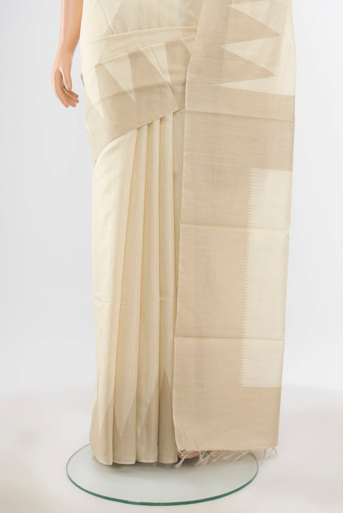 Pleats and pallu of Pure Silk Pure Zari Cream Tussar Saree with Zari Butta on the body and Silk Border. 