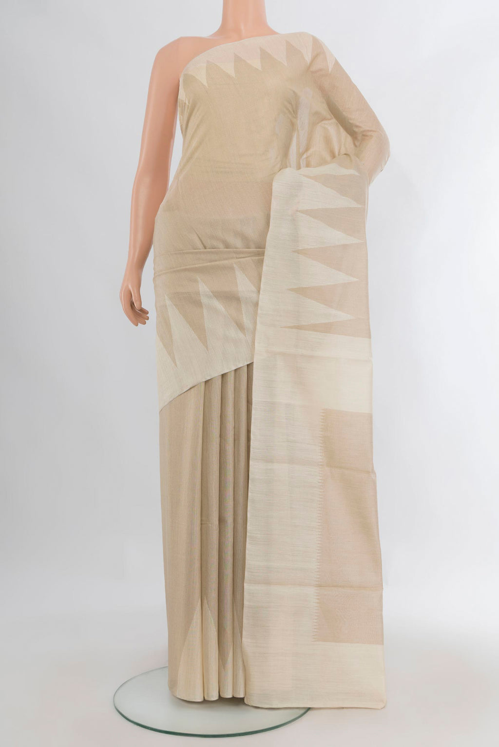 Pure Silk Cream Tussar Saree with Plain Body and Temple Border.  displayed on a mannequin