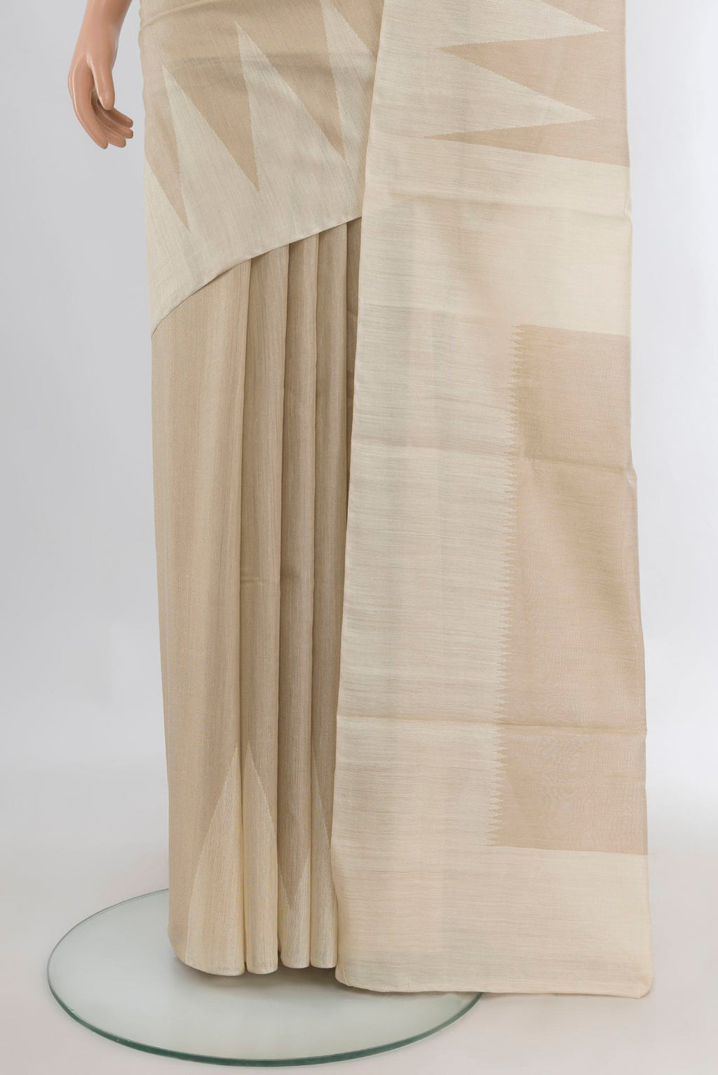 Pleats and pallu of Pure Silk Cream Tussar Saree with Plain Body and Temple Border. 