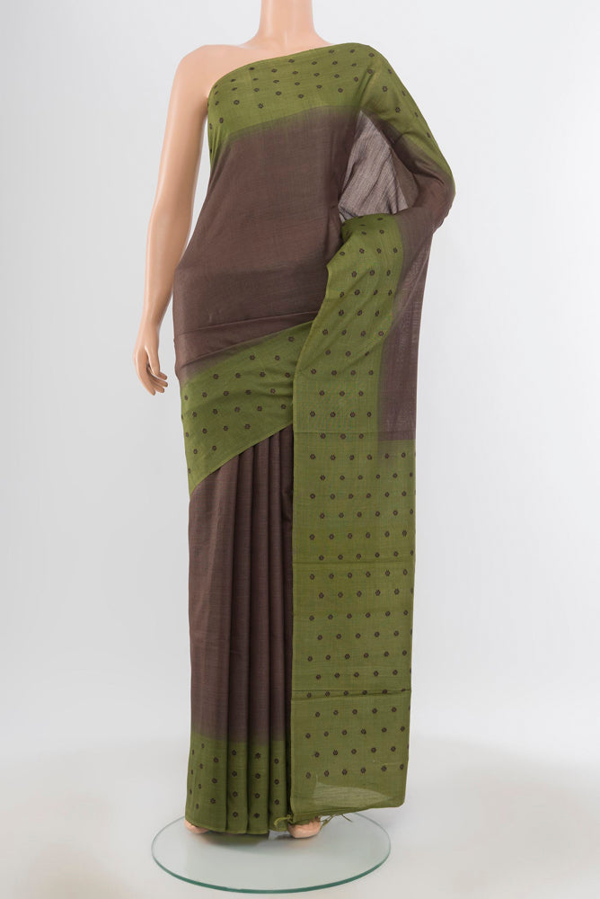 Pure Silk Pure Zari Brown Tussar Saree with Zari Butta on the body and Silk Border.  displayed on a mannequin