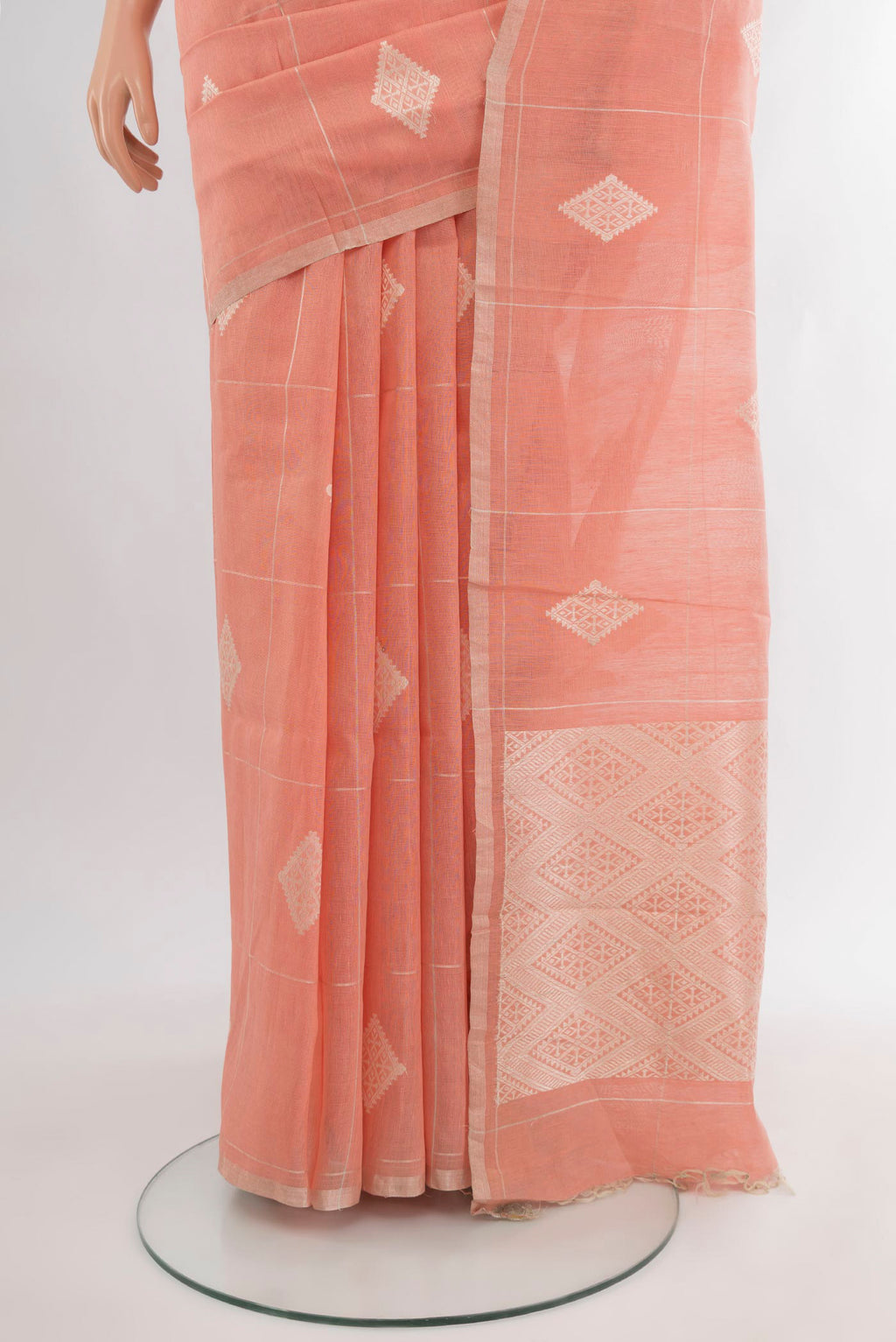 Pleats and pallu of Peach Tussar Silk Saree with Checked design on the body and Zari Border. 