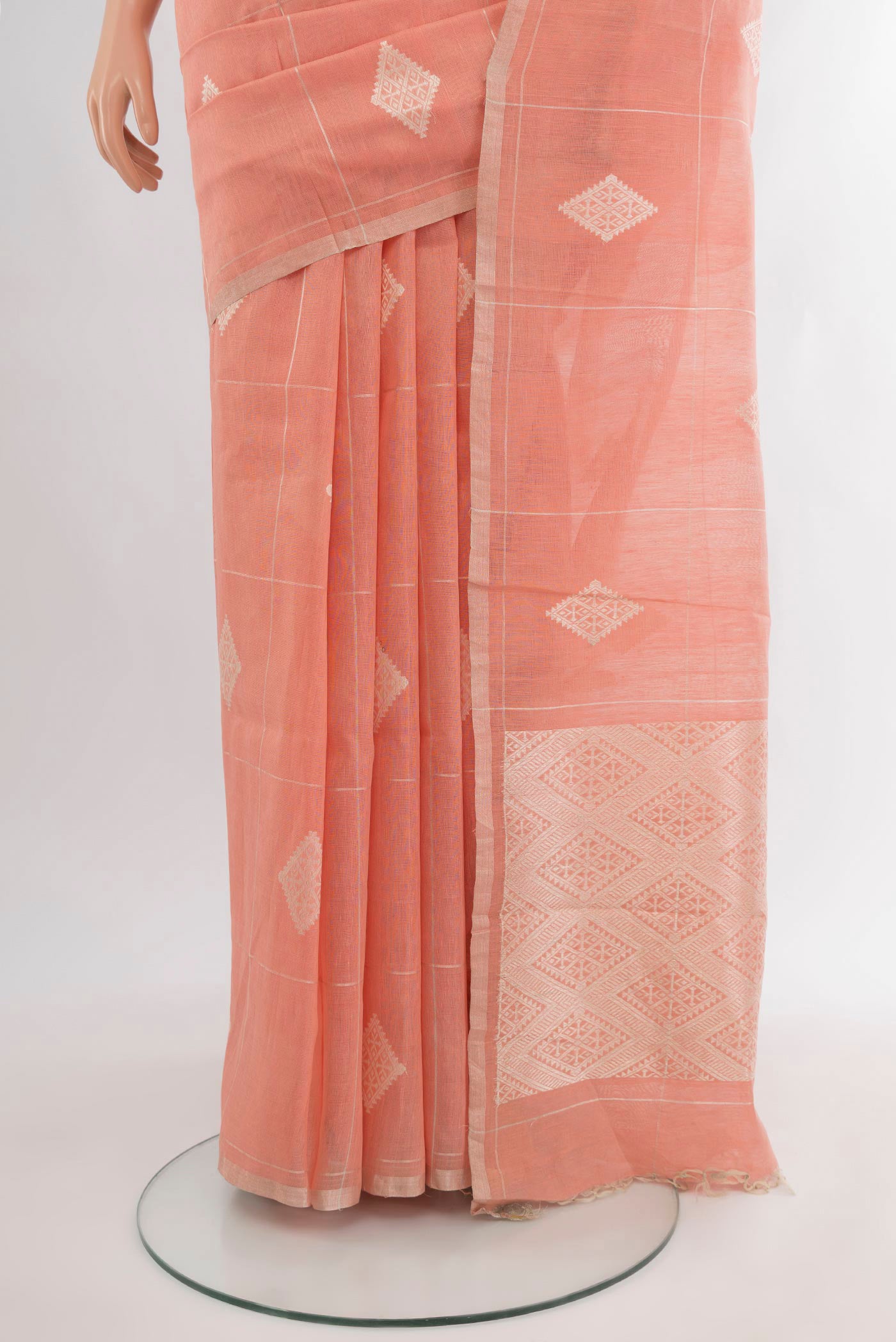 Pleats and pallu of Peach Tussar Silk Saree with Checked design on the body and Zari Border. 