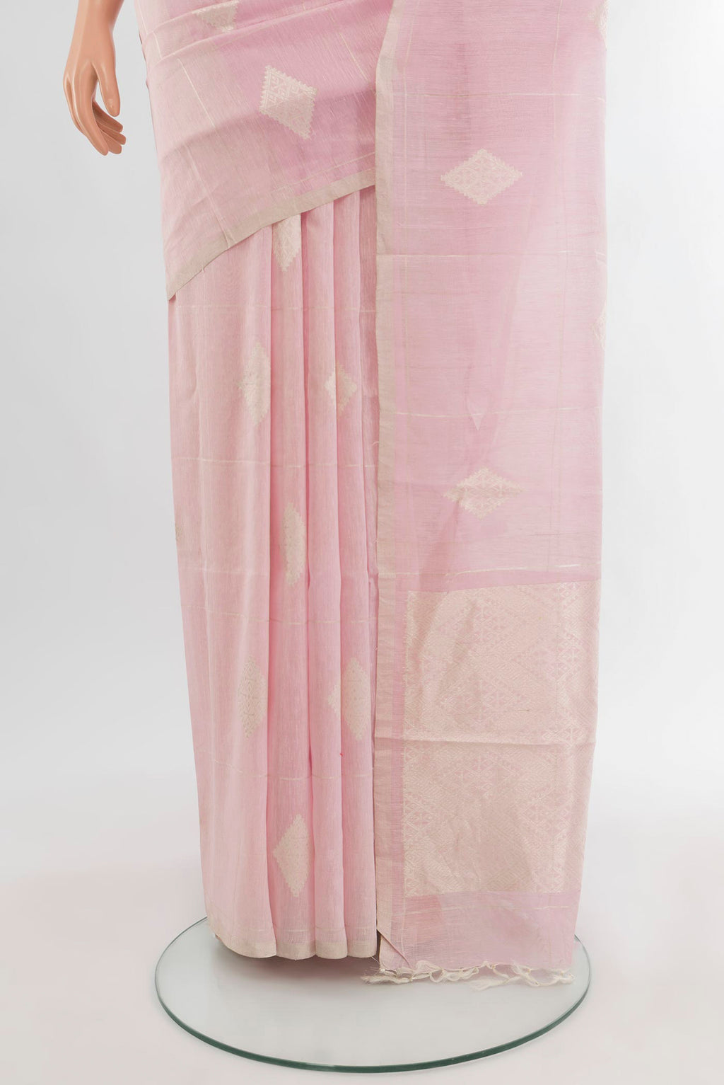 Pleats and pallu of Rose pink Tussar Silk Saree with Zari Butta on the body and Zari Border. 