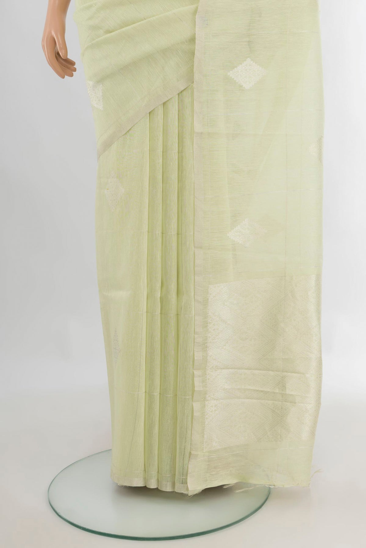 Pleats and pallu of Pure Silk Light Green Tussar Saree with Thread Butta on the body and Plain Border. 