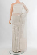 Grey Tussar Saree with Zari Butta on the body and Without Border.  displayed on a mannequin