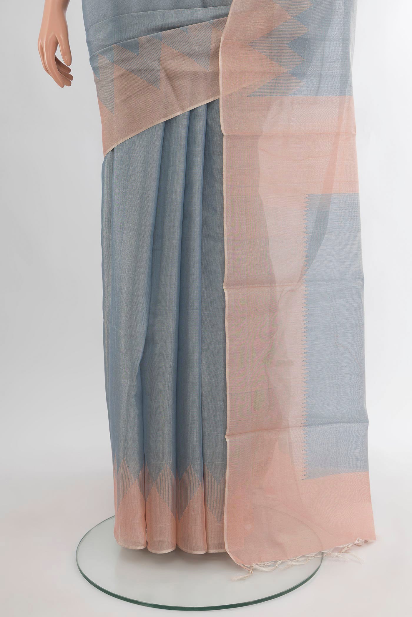 Pleats and pallu of Blue Tussar Silk Saree with Plain Body and Temple Border. 