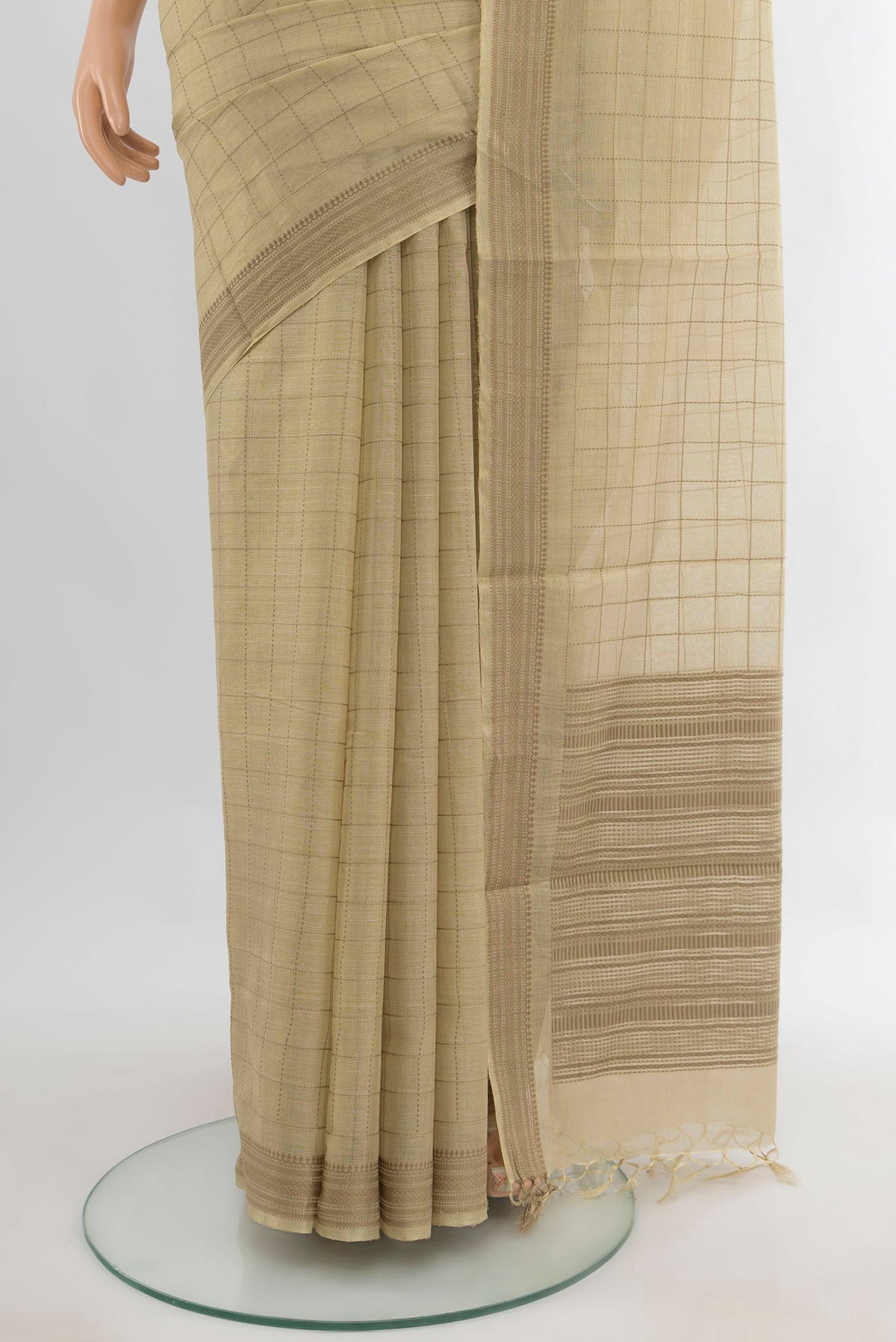 Pleats and pallu of Beige Tussar Saree with Checked design on the body and Thread Border. 