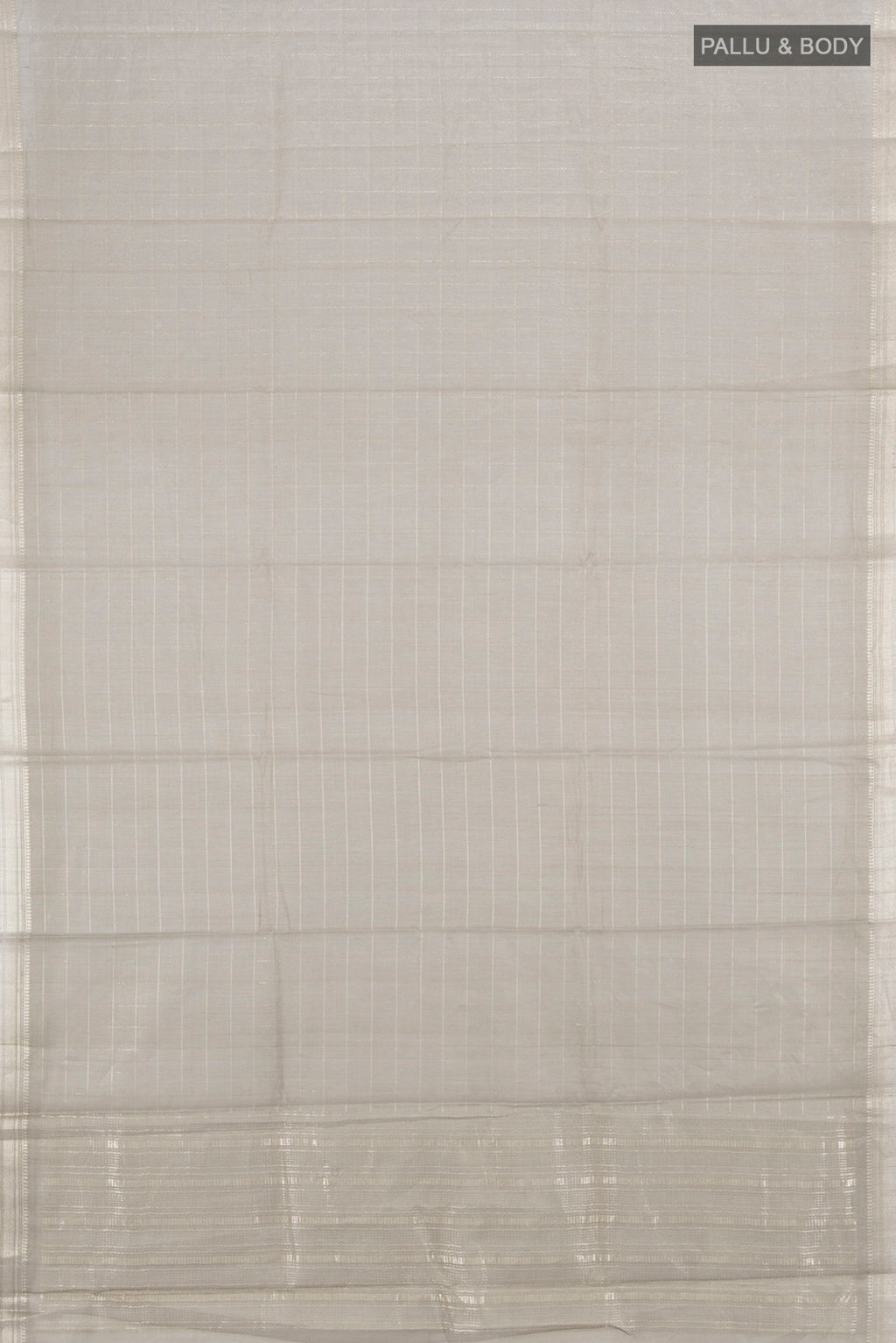 Flat view of Grey Tussar Silk Saree with Zari Butta on the body and Silk Border. 