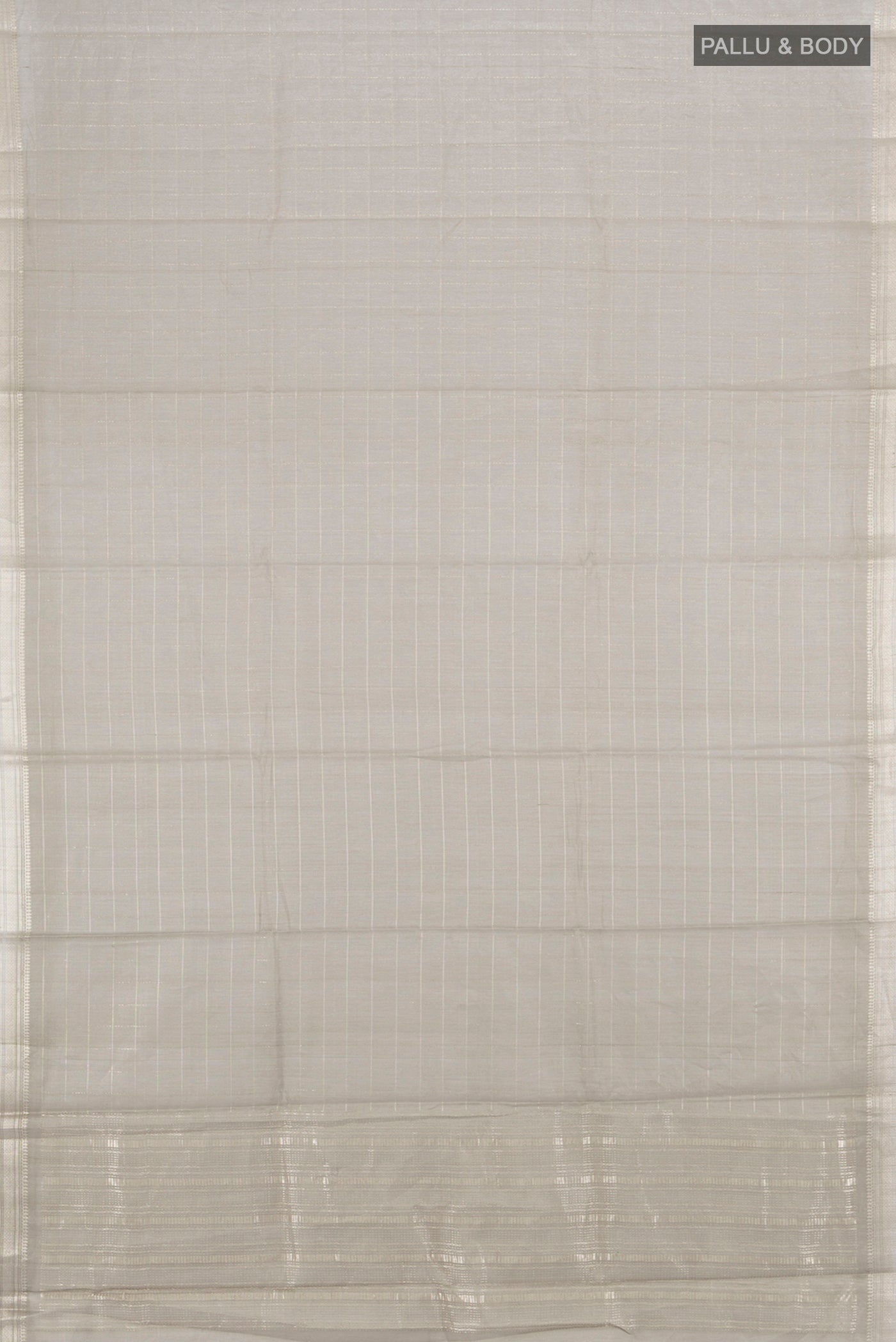 Flat view of Grey Tussar Silk Saree with Zari Butta on the body and Silk Border. 