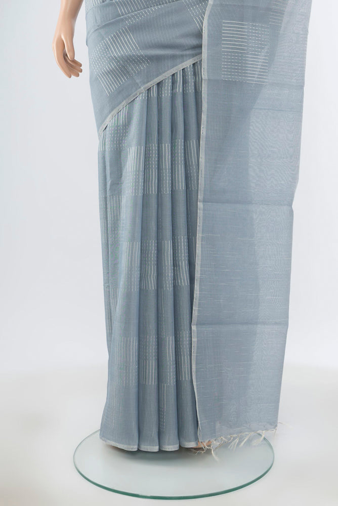 Pleats and pallu of Pure Silk Pure Zari Davys Grey Tussar Saree with Zari Butta on the body and Silk Border. 