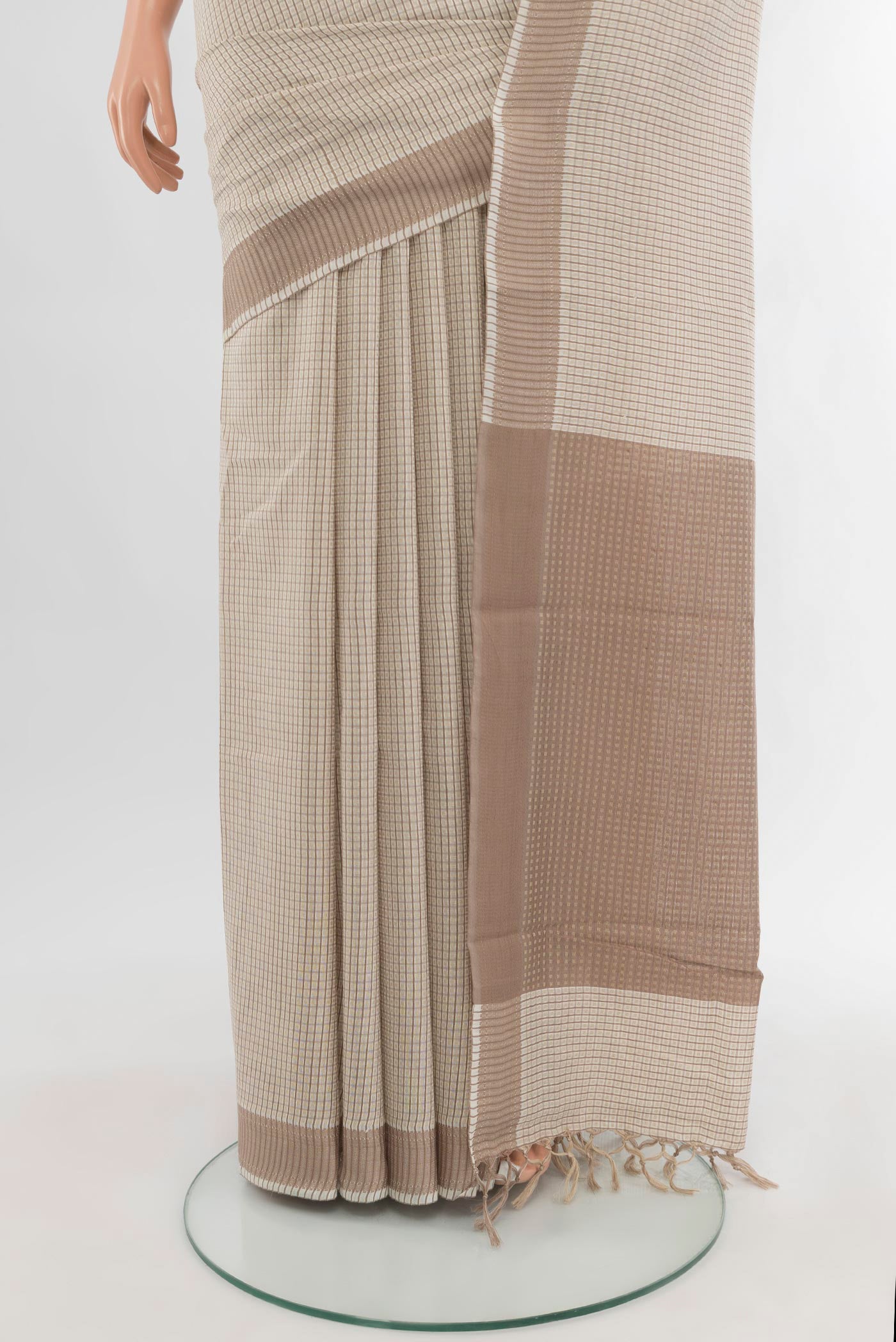 Pleats and pallu of Off White Tussar Silk Saree with Checked design on the body and Zari Border. 