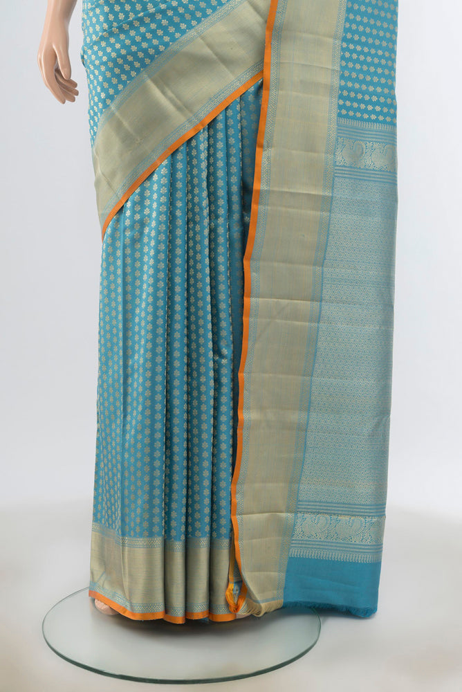 Pleats and pallu of Light Blue Kanchipuram Silk Saree with Zari Butta on the body and Silk Border. 