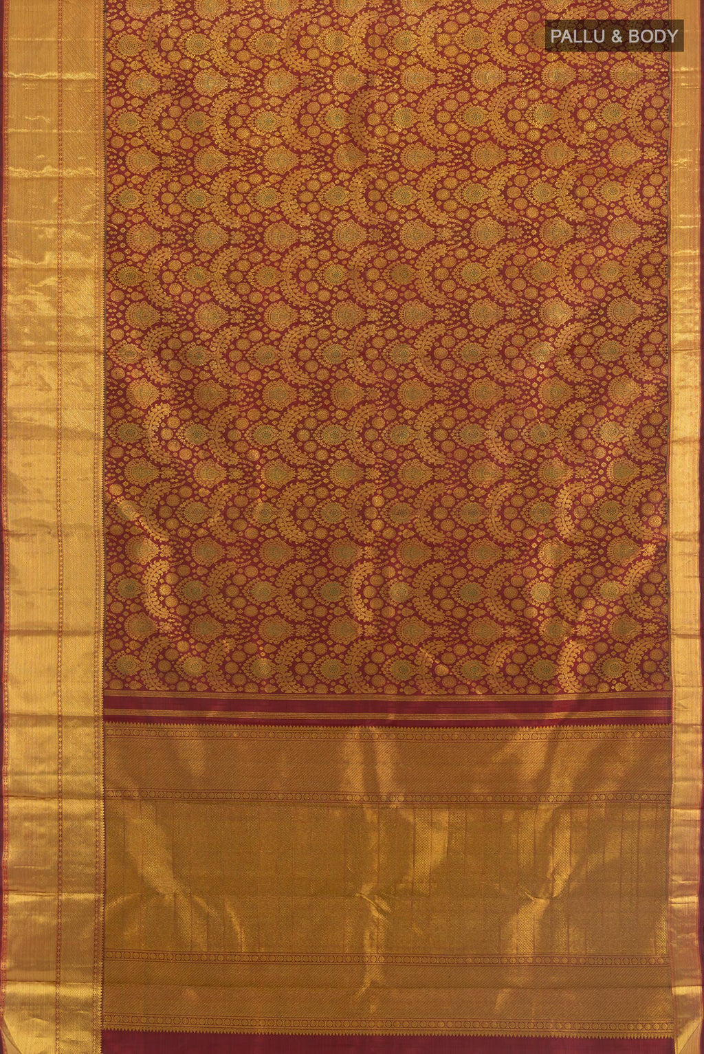 Flat view of Maroon Kanchipuram Silk Saree with Zari Brocade on the body and Zari Border. 