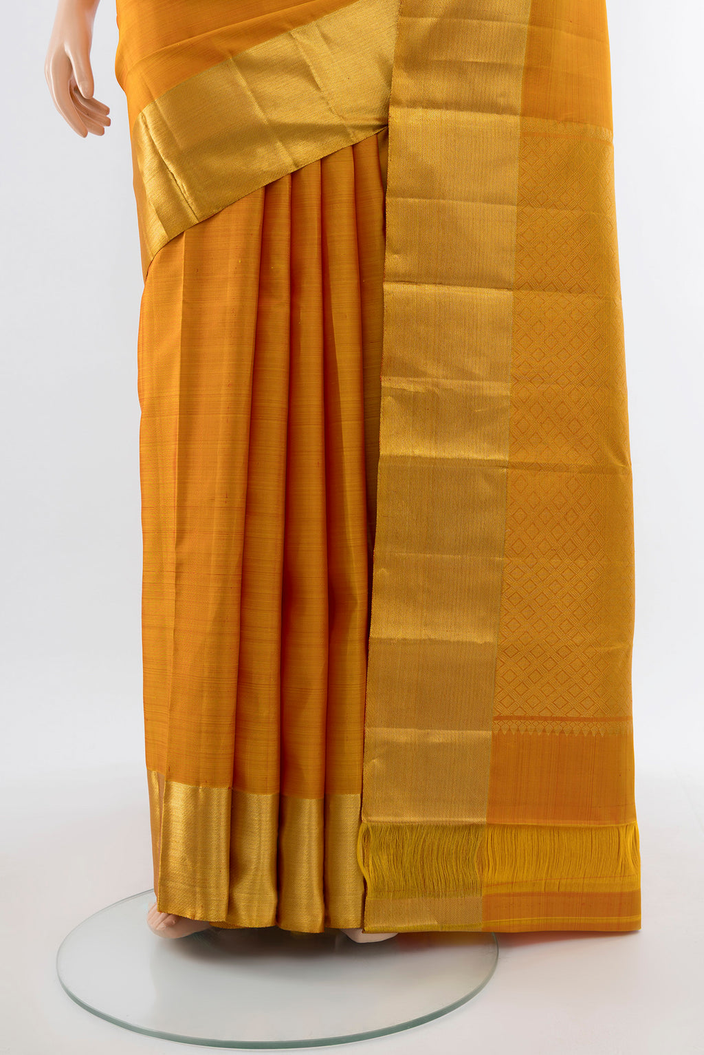 Pleats and pallu of Mustard Kanjivaram Silk Saree with Zari Butta on the body and Silk Border. 