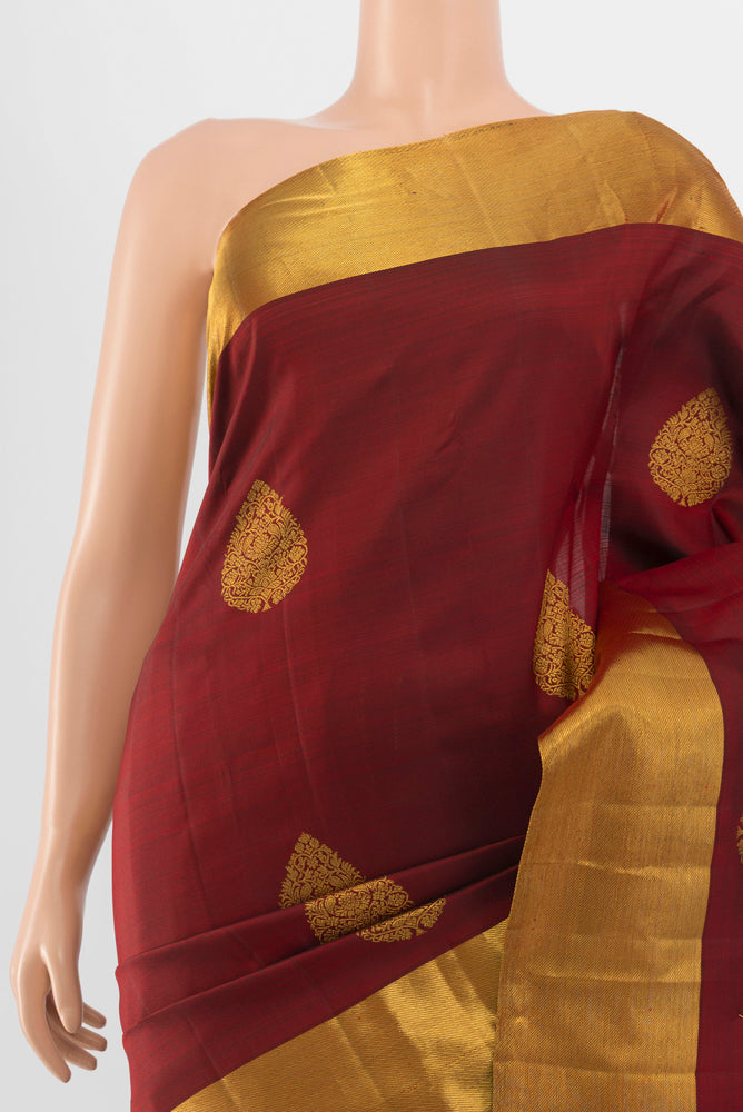 Border image of Pure Silk Pure Zari Maroon Kanchipuram Saree with Zari Butta on the body and Silk Border. 