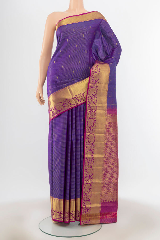 Violet Kanchipuram Silk Saree with Zari Butta on the body and Silk Border.  displayed on a mannequin