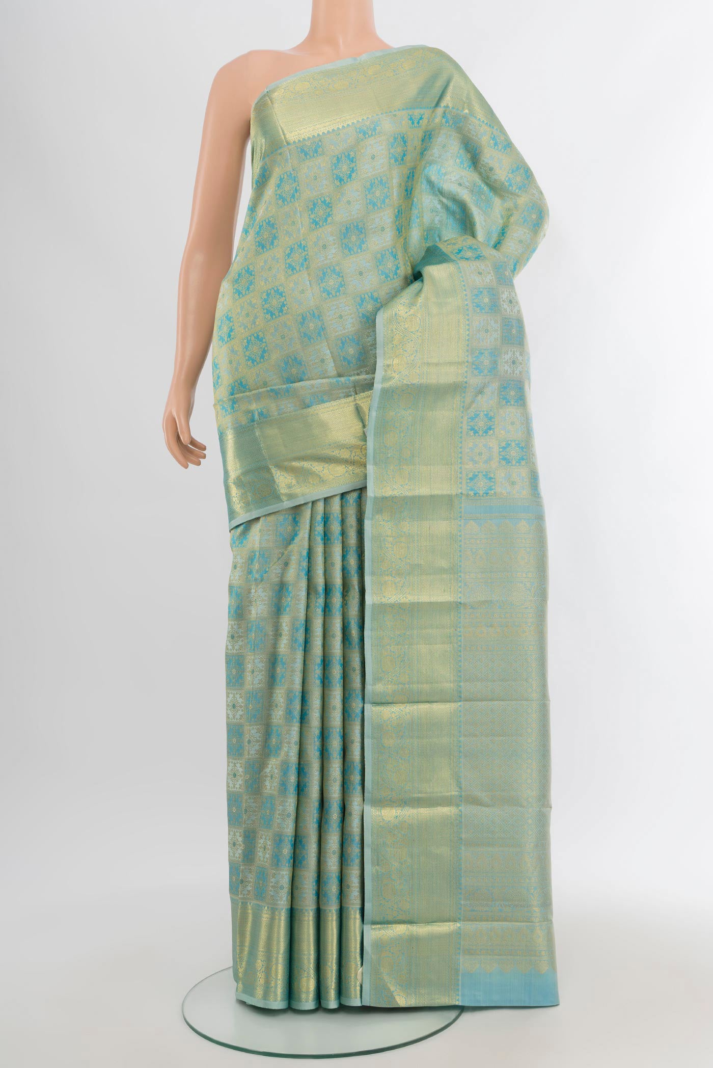 Sky Blue Kanchipuram Silk Saree with Zari Brocade on the body and Zari Border.  displayed on a mannequin