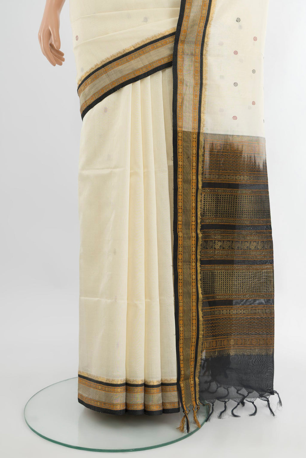 Pleats and pallu of Off White Silk Cotton Saree with Thread Butta on the body and Zari Border. 