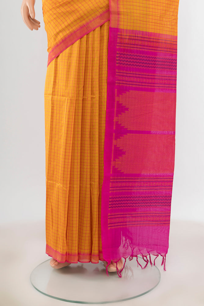 Pleats and pallu of Yellow Silk Cotton Saree with Zari Butta on the body and Silk Border. 