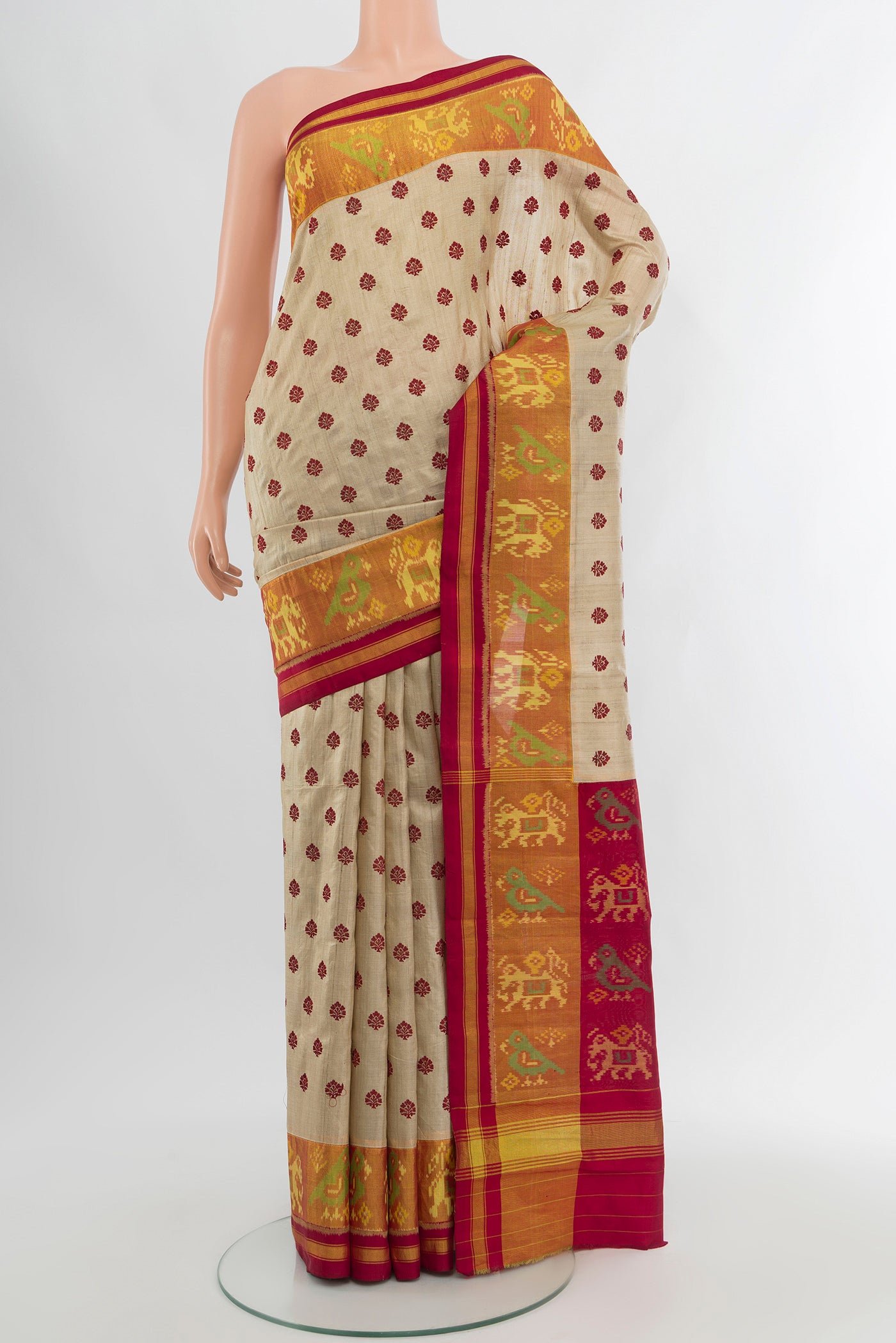 Beige Tussar Silk Saree with Embroidery on the body and Attached Border.  displayed on a mannequin