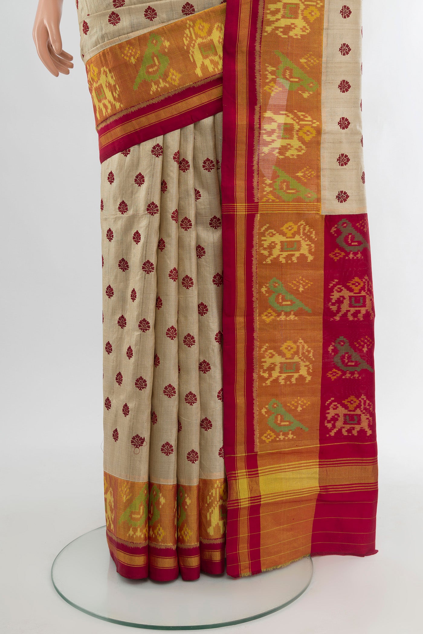 Pleats and pallu of Beige Tussar Silk Saree with Embroidery on the body and Attached Border. 