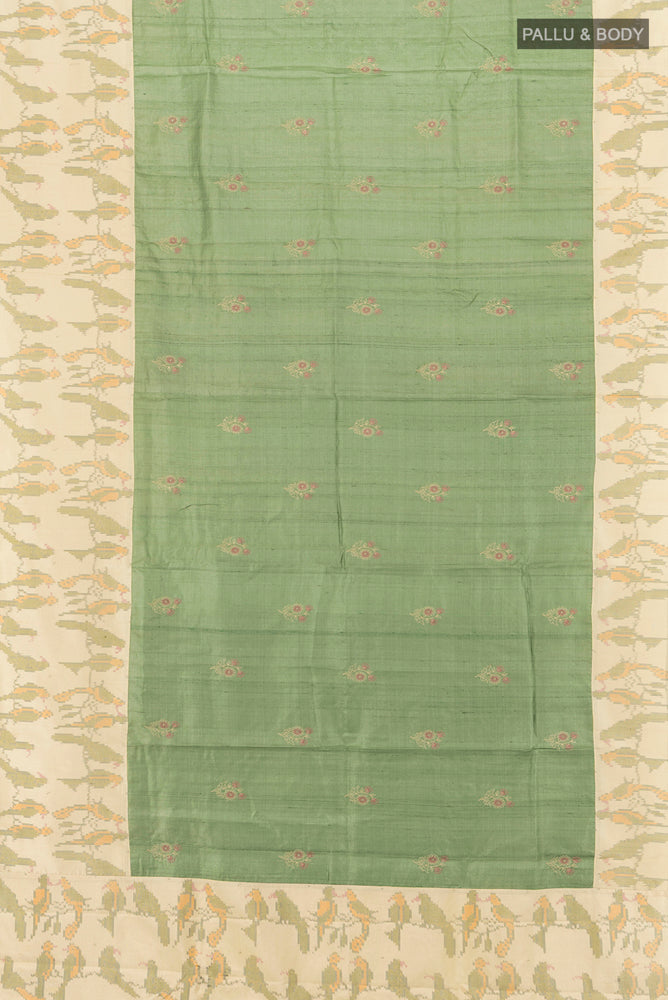 Flat view of Pure Silk Pure Zari Light Green Tussar Saree with Zari Butta on the body and Silk Border. 