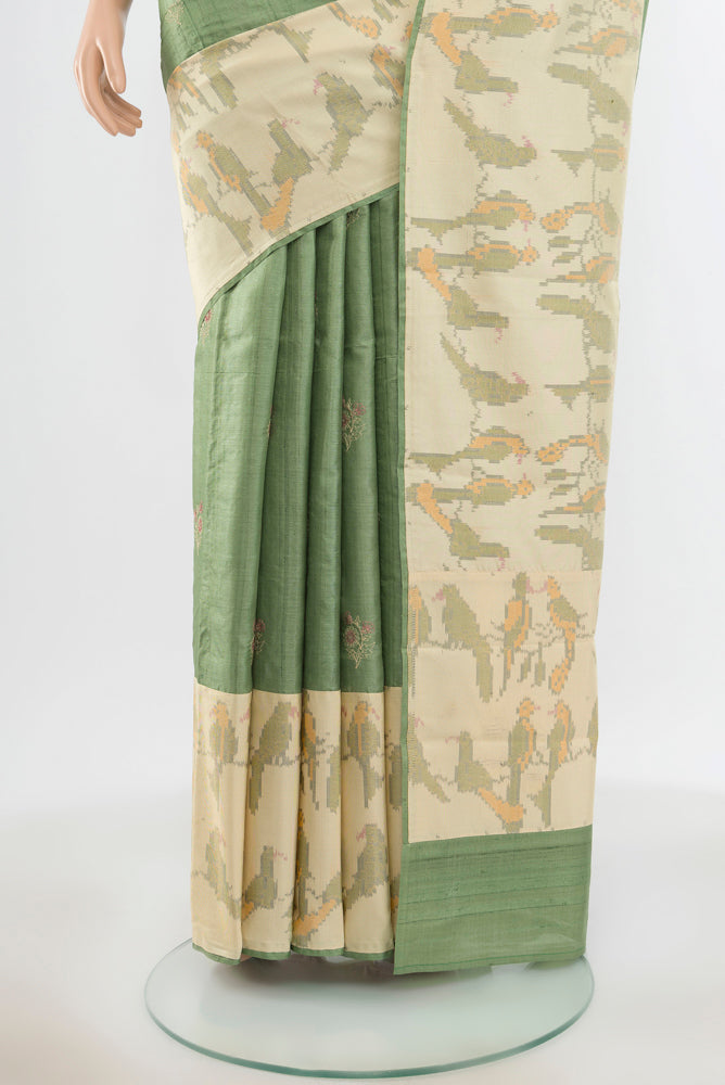 Pleats and pallu of Pure Silk Pure Zari Light Green Tussar Saree with Zari Butta on the body and Silk Border. 