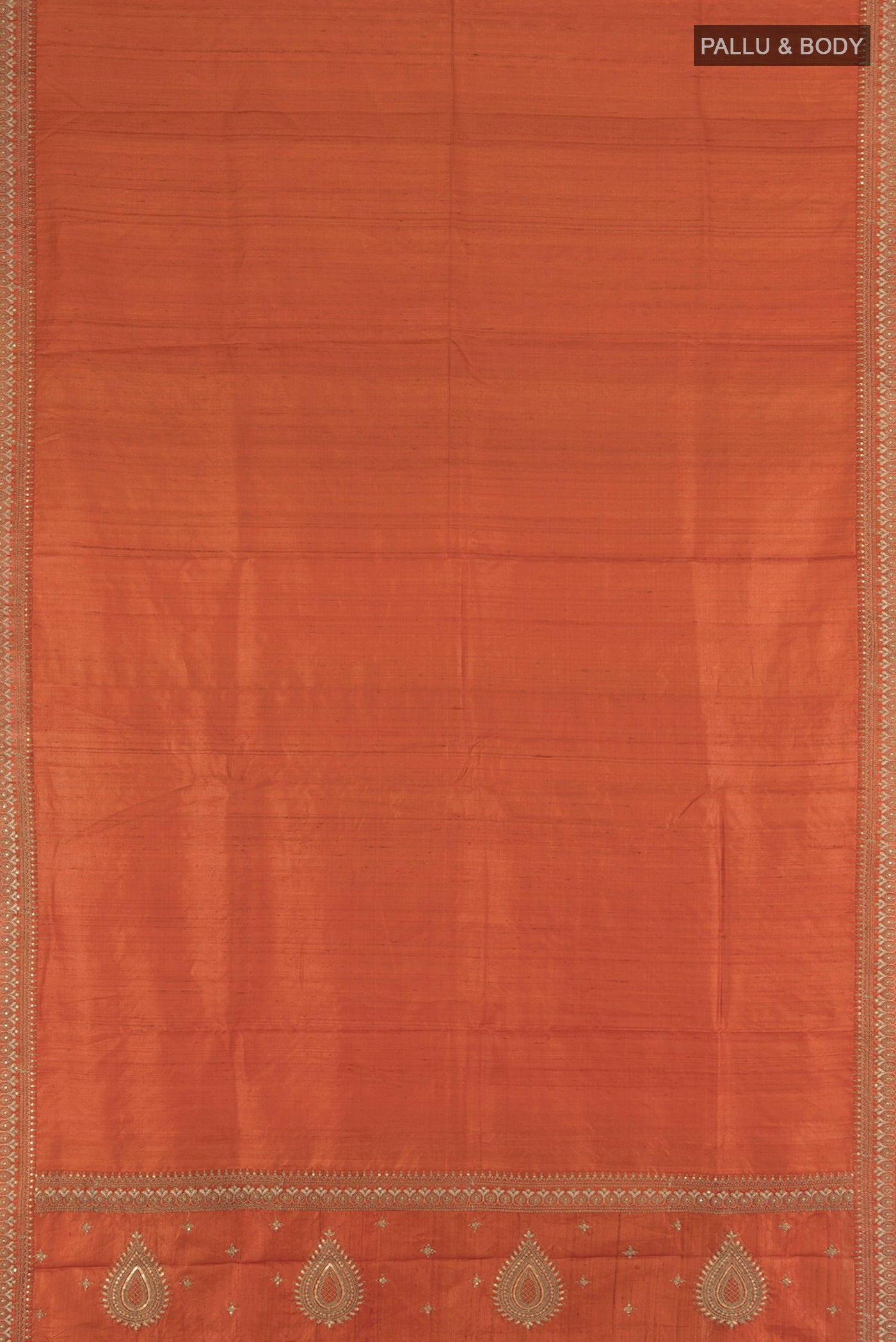 Flat view of Rust Tussar Silk Saree with Plain Body and Embroidery Border. 