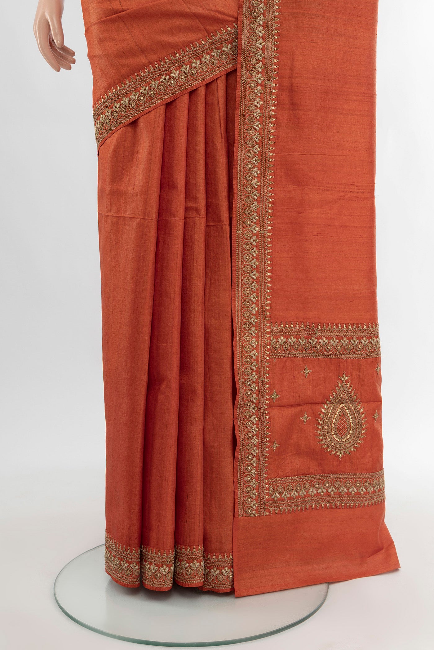 Pleats and pallu of Rust Tussar Silk Saree with Plain Body and Embroidery Border. 