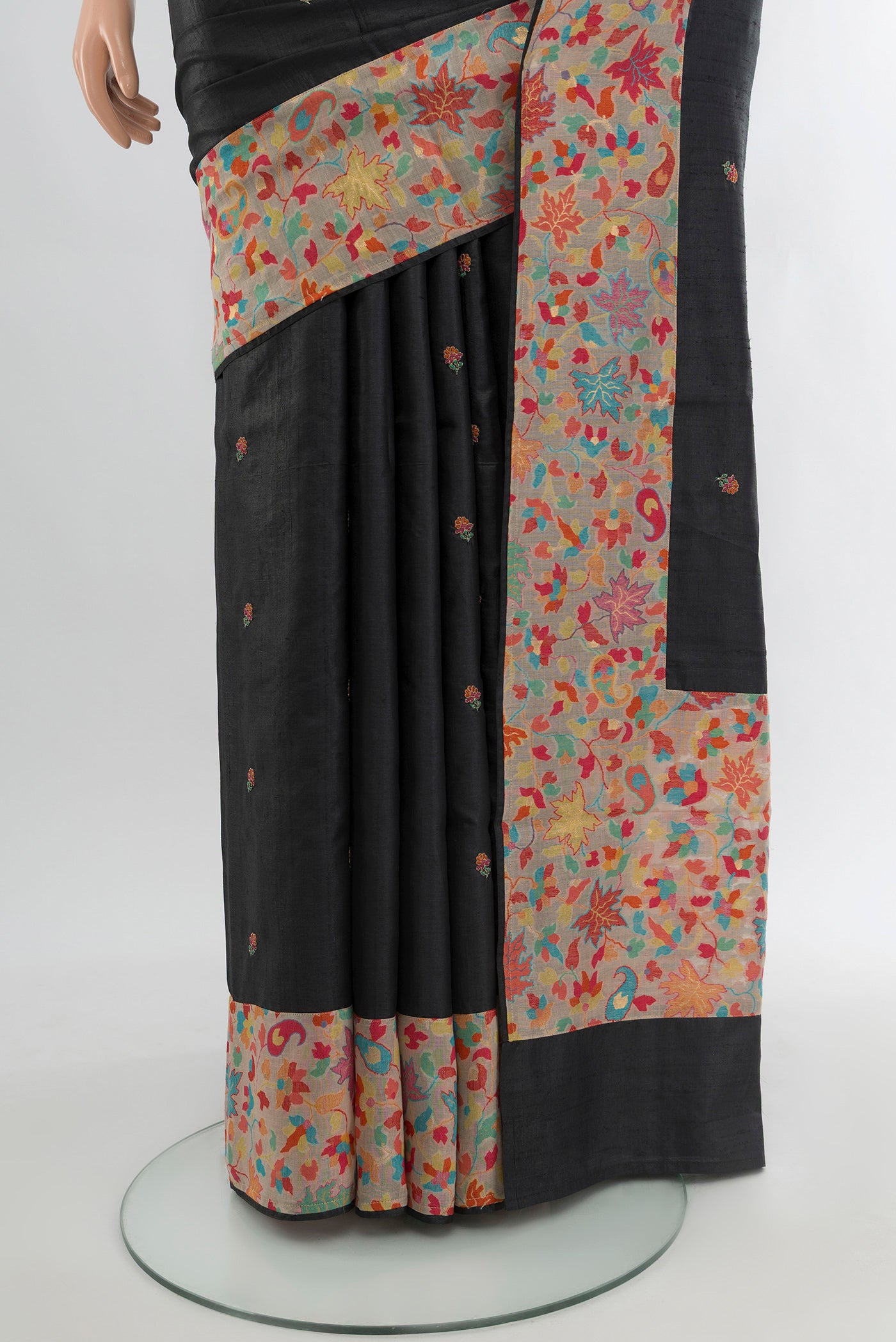 Pleats and pallu of Black Tussar Silk Saree with Embroidery on the body and Attached Border. 