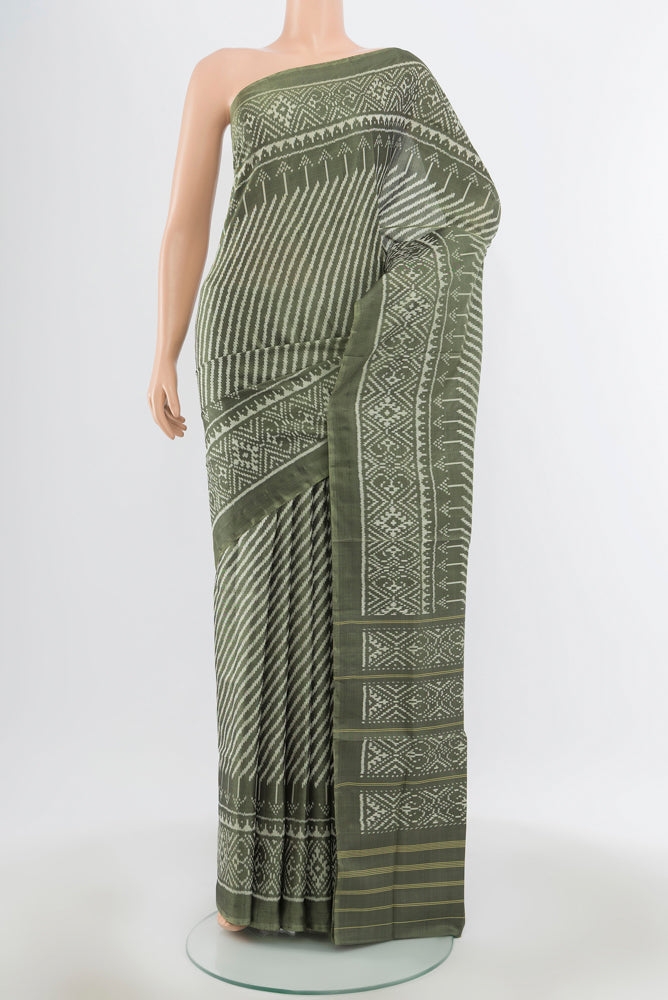 Pure Silk Pure Zari Light Green Rajkot Patola Saree with Zari Butta on the body and Silk Border.  displayed on a mannequin