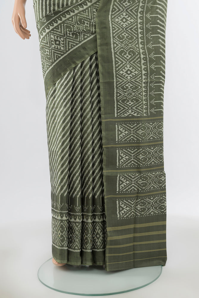 Pleats and pallu of Pure Silk Pure Zari Light Green Rajkot Patola Saree with Zari Butta on the body and Silk Border. 