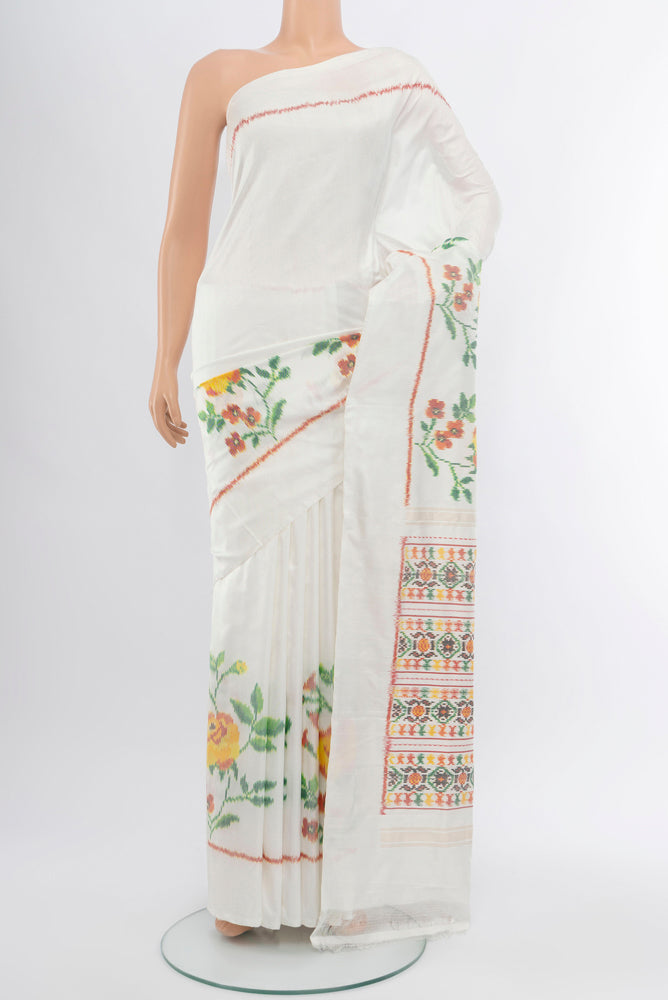 Off White Rajkot Patola Silk Saree with Ikat Print on the body and Silk Border.  displayed on a mannequin
