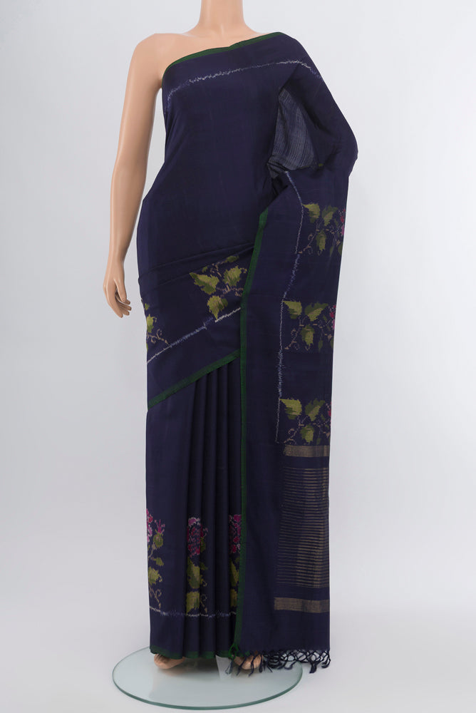 Navy Blue Rajkot Patola Silk Saree with Ikat Print on the body and Silk Border.  displayed on a mannequin
