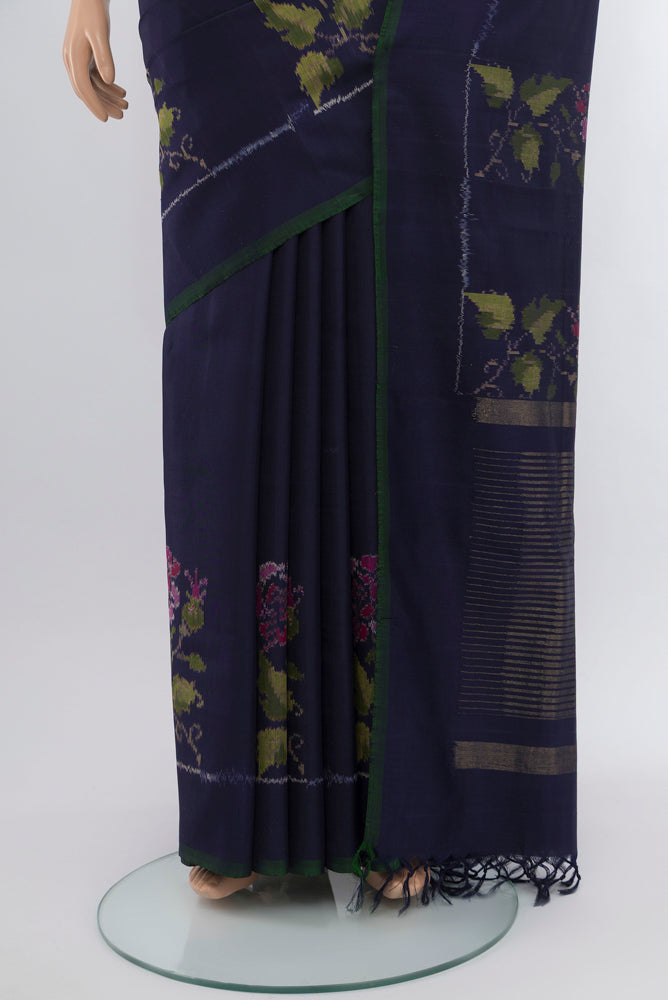 Pleats and pallu of Navy Blue Rajkot Patola Silk Saree with Ikat Print on the body and Silk Border. 