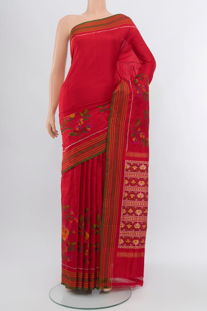 Red Rajkot Patola Silk Saree with Ikat Print on the body and Silk Border.  displayed on a mannequin