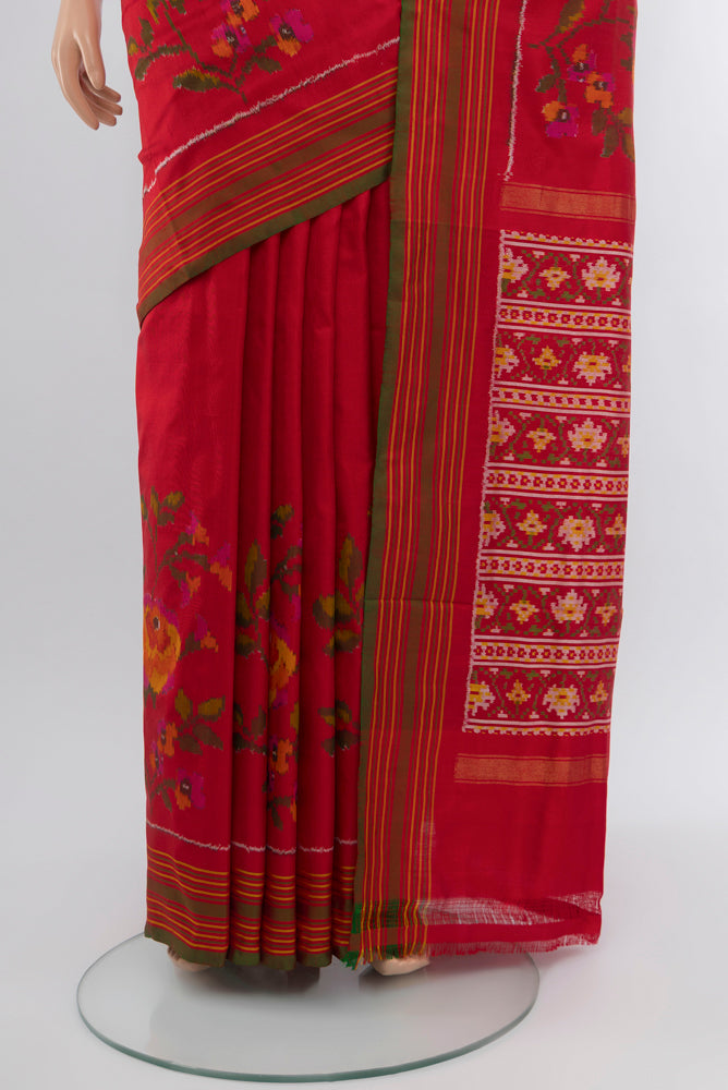 Pleats and pallu of Red Rajkot Patola Silk Saree with Ikat Print on the body and Silk Border. 